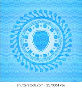shield icon inside sky blue water style emblem.