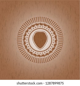 shield icon inside wood badge or emblem