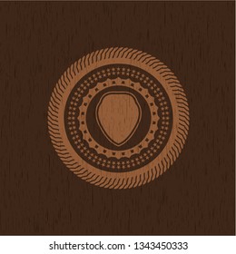 shield icon inside wood badge or emblem