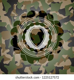 shield icon on camouflage pattern