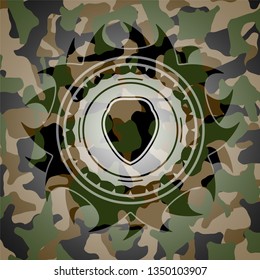 shield icon on camouflaged texture