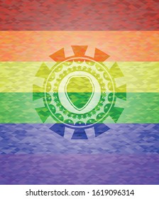 shield icon on mosaic background with the colors of the LGBT flag