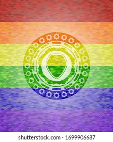 icono del escudo sobre fondo de mosaico con los colores de la bandera LGBT