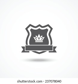 Shield icon with ribbon and crown