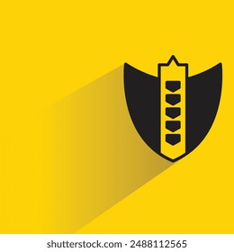 icono de escudo con sombra sobre fondo amarillo
