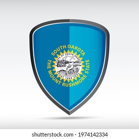 Shield icon with South Dakota State Flag on gray bacground. Vector illustration.