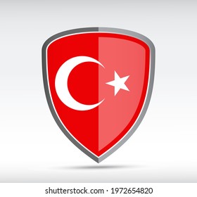 Shield icon with state flag of Turkey country on gray bacground. Vector illustration.
