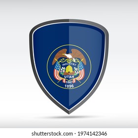 Shield icon with Utah State Flag on gray bacground. Vector illustration.
