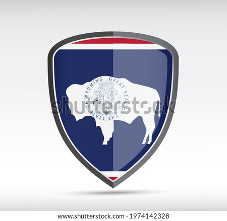 Shield icon with Wyoming State Flag on gray bacground. Vector illustration.