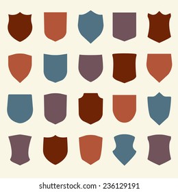 Shield icons set. Different colorful shield shapes in flat style. Vector illustration.
