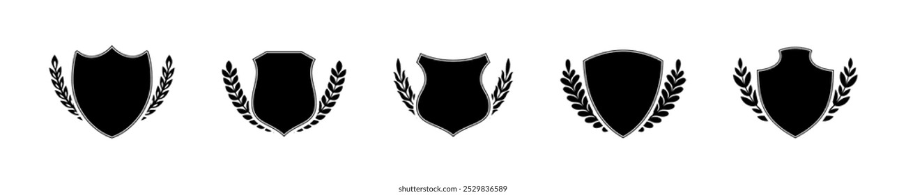 Shield with laurel twigs vector icons. Shield with laurel twigs around it