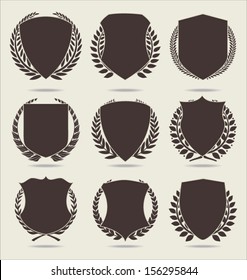 Shield and laurel wreath