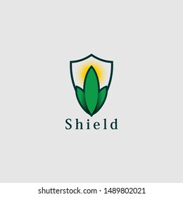 Shield with leaf concept logo vector design