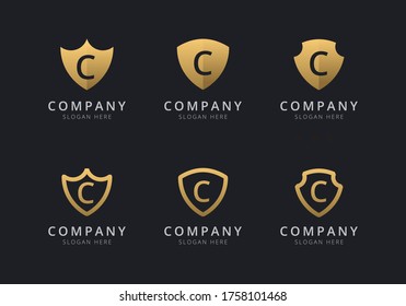 Plantilla de logotipo Escudo con color de estilo dorado para la empresa