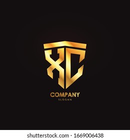 logotipo de escudo XC oro gráfico