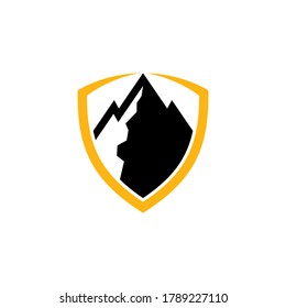 Shield and mountain emblem badge logo template in black and yellow color