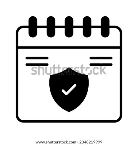 Shield on calendar showing concept icon of insurance validity, insurance calendar