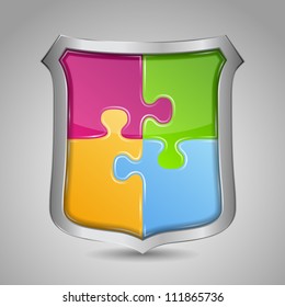 Shield with puzzle pieces, vector eps10 illustration