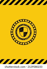 shield, safety icon black grunge emblem inside yellow warning sign. Vector Illustration. Detailed. 
