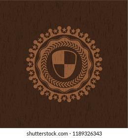 shield, safety icon inside badge with wooden background