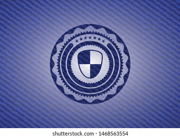 shield, safety icon inside badge with denim background