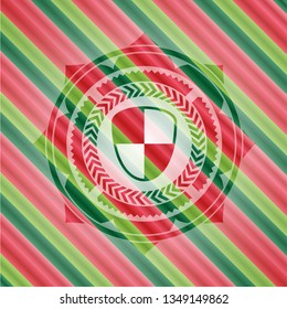 shield, safety icon inside christmas colors badge.