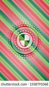 shield, safety icon inside christmas colors badge.