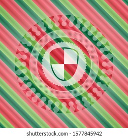 shield, safety icon inside christmas colors emblem.