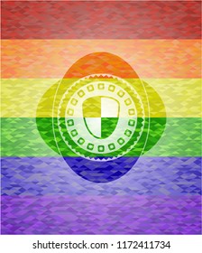 shield, safety icon inside emblem on mosaic background with the colors of the LGBT flag