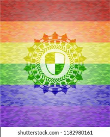 shield, safety icon inside emblem on mosaic background with the colors of the LGBT flag