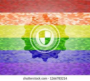 shield, safety icon inside emblem on mosaic background with the colors of the LGBT flag