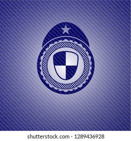 shield, safety icon inside emblem with jean background