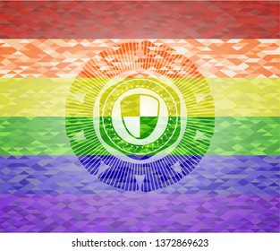 shield, safety icon inside emblem on mosaic background with the colors of the LGBT flag