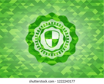 shield, safety icon inside green emblem with mosaic background