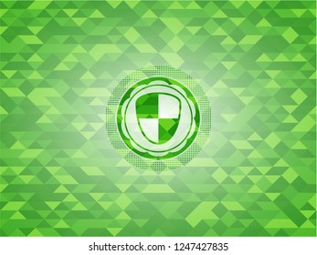 shield, safety icon inside green mosaic emblem