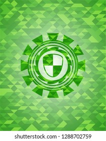 shield, safety icon inside green emblem. Mosaic background