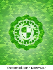shield, safety icon inside green emblem with mosaic background