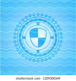 shield, safety icon inside light blue water wave style badge.