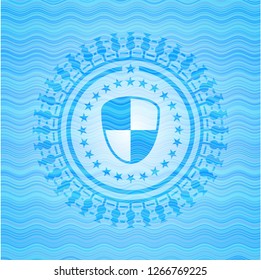 shield, safety icon inside light blue water wave emblem.