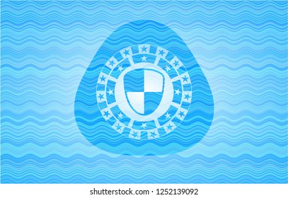 shield, safety icon inside water wave emblem.