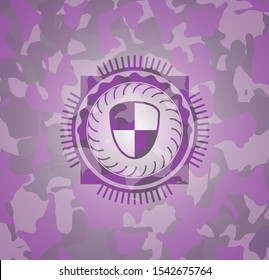 shield, safety icon on pink camo pattern