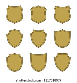 Shield shape gold icons set. Simple flat logo on white background. Symbol of security, protection, safety, strong. Element badge for protect design emblem decoration. Vector illustration