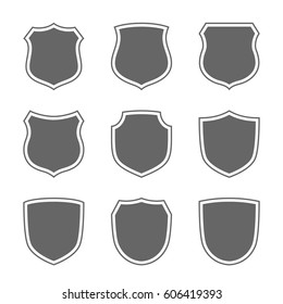 Shield shape icons set. Gray label signs isolated on white. Symbol of protection, arms, coat honor, security, safety. Flat retro style design. Element vintage heraldic emblem Vector illustration