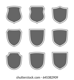 Shield shape icons set. Gray label signs isolated on white background. Symbol of protection, arms, security, safety. Flat retro style design. Element vintage heraldic emblem Vector illustration