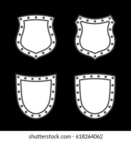 Shield shape icons set. White label signs isolated on black background. Symbol of protection, arms, security, safety. Flat retro style design. Element vintage heraldic emblem Vector illustration