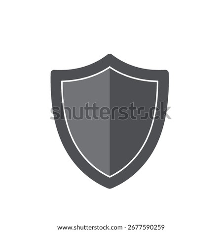Shield stands against a white space, divided into light and dark gray halves, symbolizing protection and security with a simple, clean aesthetic.
