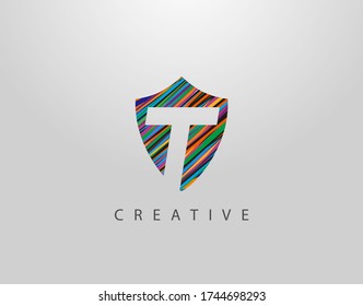 Logo De La Letra Shield T. Diseño geométrico abstracto moderno, compuesto por varias tiras coloridas  
