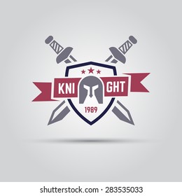 shield which shows knight helmet and behind which two crossed swords with ribbon for text isolated vector sport team emblem template