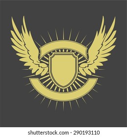 Shield with wings. Gold wings and shield on gray background