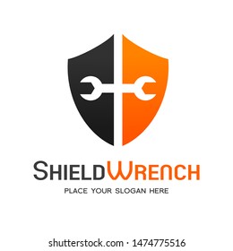 Shield with wrench vector logo template with orange and black color.